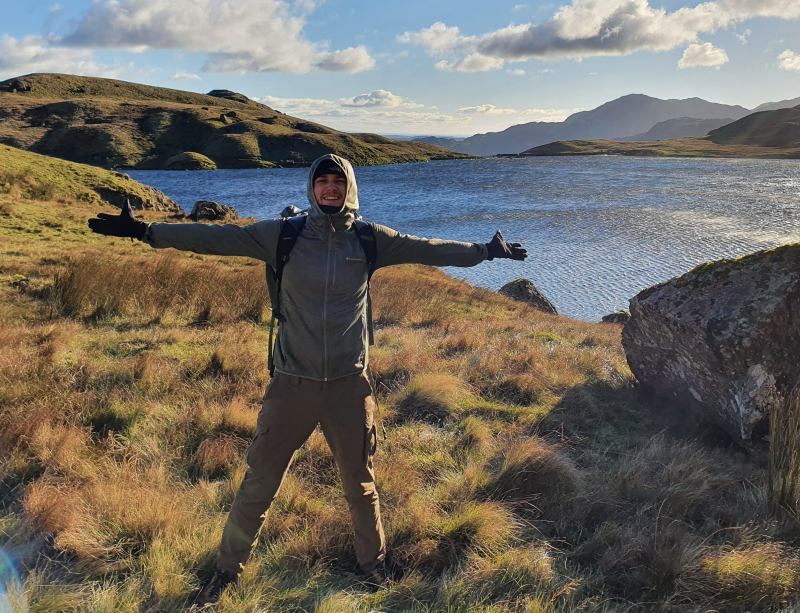 Michel in a meadow by a lake