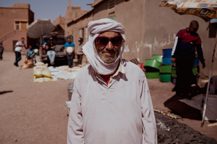 Man wearing a turban in front of a street